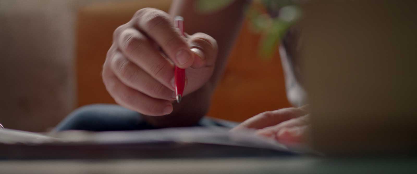 a person sketching an IBP blueprint on paper