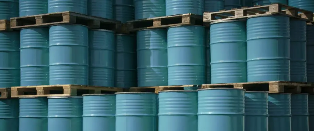 Stacked blue oil barrels